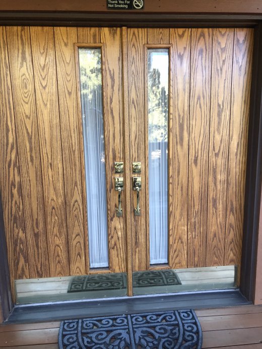 Front door before restaining and new kickplates