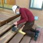 Ed sanding the deck stairs